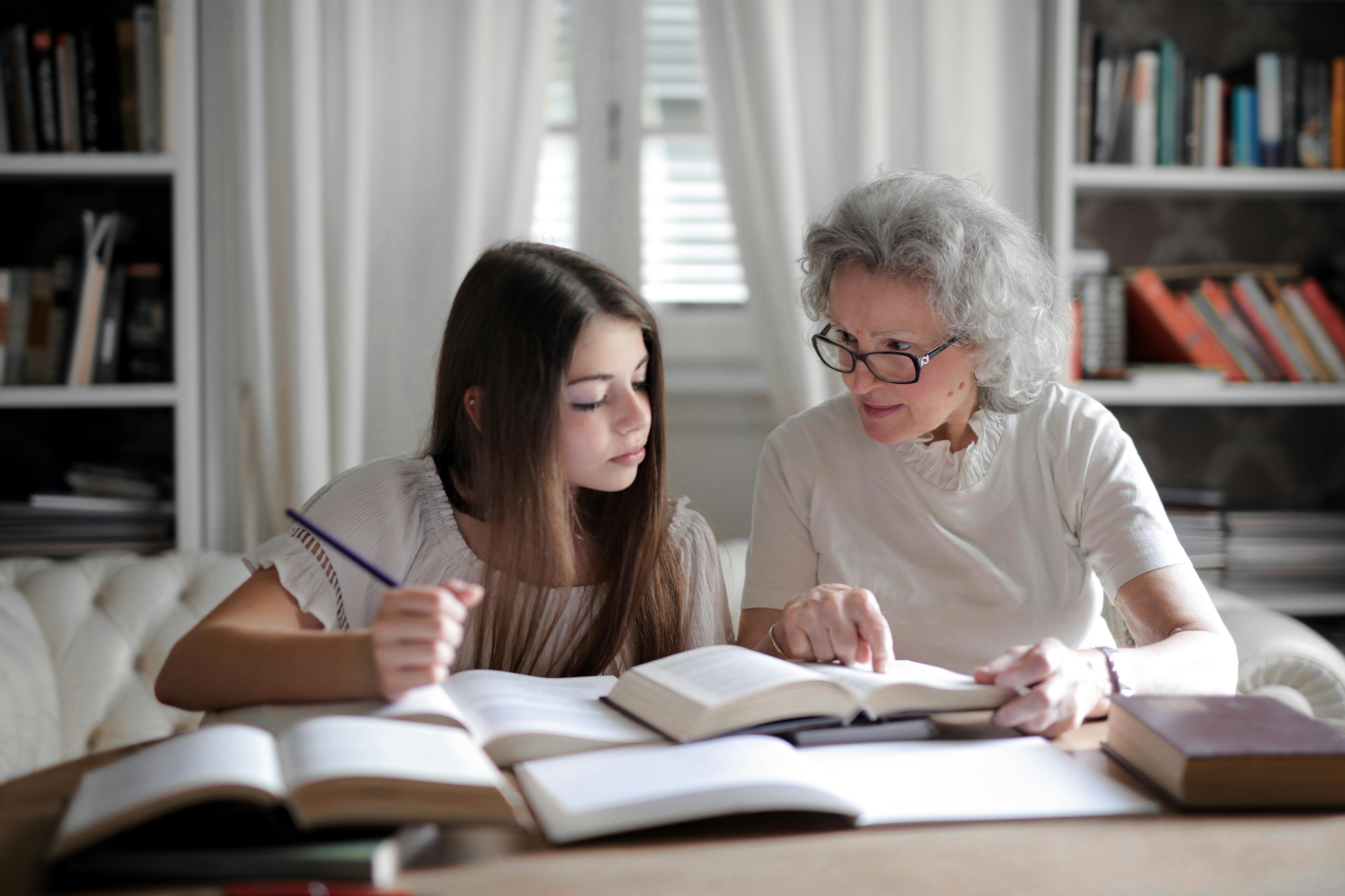 Private tutor helping a student with homework